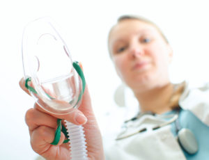 dental assistant administering nitrous oxide