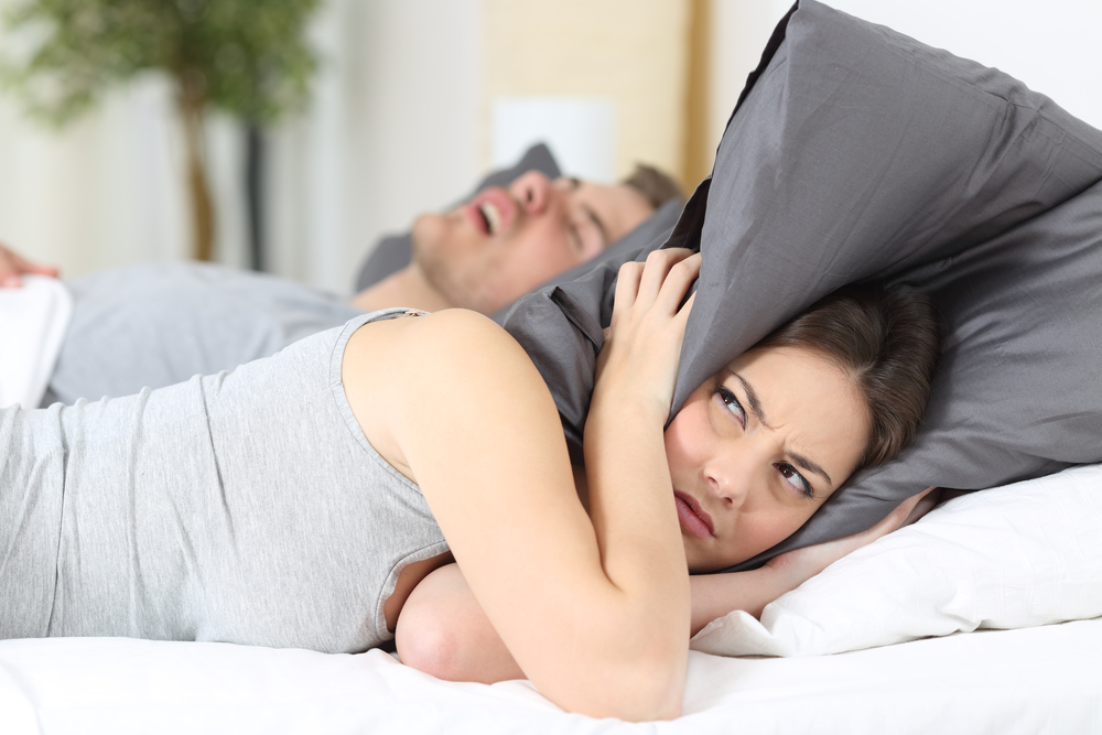 wife bothered by her husband's snoring